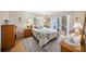 Bright bedroom with a large bed and sliding glass doors leading to an outdoor seating area at 3664 Lake Bayshore Dr # K323, Bradenton, FL 34205