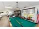 Community room featuring a pool table and library for resident use at 3664 Lake Bayshore Dr # K323, Bradenton, FL 34205