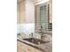 Updated kitchen sink with granite countertops, designer tile backsplash, and natural light at 3664 Lake Bayshore Dr # K323, Bradenton, FL 34205