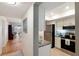Bright kitchen with stainless steel appliances and granite countertops open to living area at 3664 Lake Bayshore Dr # K323, Bradenton, FL 34205