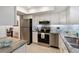 Updated kitchen with stainless steel appliances, granite countertops and white cabinetry at 3664 Lake Bayshore Dr # K323, Bradenton, FL 34205