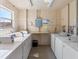 Bright laundry room featuring multiple white washers and dryers for tenant use at 3664 Lake Bayshore Dr # K323, Bradenton, FL 34205