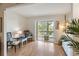 Bright living room with a sliding glass door leading to a balcony and comfortable seating arrangements at 3664 Lake Bayshore Dr # K323, Bradenton, FL 34205