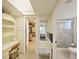 Office with a desk, shelves, and a view of the walk-in closet and en-suite bathroom at 3664 Lake Bayshore Dr # K323, Bradenton, FL 34205