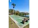 Outdoor shuffleboard court with benches, and picturesque lake view at 3664 Lake Bayshore Dr # K323, Bradenton, FL 34205