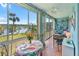 Cozy sunroom with comfortable seating, water view, and bright decor at 3664 Lake Bayshore Dr # K323, Bradenton, FL 34205