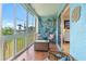 Bright sunroom with comfortable seating and nautical-themed decorations at 3664 Lake Bayshore Dr # K323, Bradenton, FL 34205