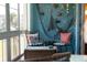 Bright sunroom with comfortable seating and nautical-themed decorations on the wall at 3664 Lake Bayshore Dr # K323, Bradenton, FL 34205