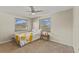 Cozy bedroom featuring carpet floors, neutral walls and two bright windows at 3809 21St W Ave, Bradenton, FL 34205
