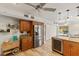 Stylish kitchen featuring stainless steel appliances, wood cabinetry, and an island with wine storage at 3809 21St W Ave, Bradenton, FL 34205