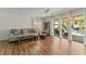 Comfortable living room with hardwood floors, stylish decor, and sliding glass doors opening to an outdoor patio at 3809 21St W Ave, Bradenton, FL 34205