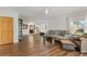 Bright living room with laminate wood flooring, neutral decor, and abundant natural light from the windows at 3809 21St W Ave, Bradenton, FL 34205