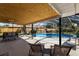 Relaxing covered outdoor patio with outdoor seating overlooking a private screened-in pool at 3809 21St W Ave, Bradenton, FL 34205