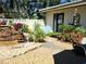 Relaxing backyard with stone waterfall feature, privacy fence, and lush landscaping at 3818 Sun Eagle Ln, Bradenton, FL 34210