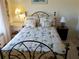Tastefully decorated bedroom with a floral bedding set, and quaint bedside lamps for a cozy space at 3818 Sun Eagle Ln, Bradenton, FL 34210