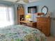 Charming bedroom with built in desk and drawers and decorative fixtures to brighten up the space at 3818 Sun Eagle Ln, Bradenton, FL 34210
