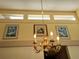 An elegant golden chandelier hanging in the living room at 3818 Sun Eagle Ln, Bradenton, FL 34210