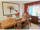 Dining room featuring a wood table with six chairs and beautiful decorations at 3818 Sun Eagle Ln, Bradenton, FL 34210