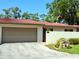 Charming home featuring a terra cotta tile roof, neutral stucco, and an attached two-car garage at 3818 Sun Eagle Ln, Bradenton, FL 34210