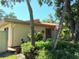 Landscaped home exterior with mature trees at 3818 Sun Eagle Ln, Bradenton, FL 34210