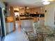 Bright kitchen featuring an island with black granite countertops and light colored cabinetry at 3818 Sun Eagle Ln, Bradenton, FL 34210