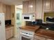 Bright kitchen with granite counters, updated appliances, and lots of storage at 3818 Sun Eagle Ln, Bradenton, FL 34210