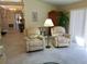 Comfortable living room with recliner chairs, neutral walls, and tile flooring at 3818 Sun Eagle Ln, Bradenton, FL 34210