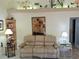 Cozy living room with sofa, glass tables, and decorative shelving at 3818 Sun Eagle Ln, Bradenton, FL 34210