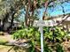 Sun Eagle Lane street sign amidst lush tropical landscaping at 3818 Sun Eagle Ln, Bradenton, FL 34210