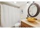 Bright bathroom with modern sink, granite countertops, and turtle wall art at 3880 Wilshire Cir # 28, Sarasota, FL 34238