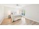 Bright bedroom with lots of natural light, ceiling fan and wood floors at 3880 Wilshire Cir # 28, Sarasota, FL 34238