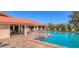 Large community pool with ample lounge seating and a well-maintained deck area at 3880 Wilshire Cir # 28, Sarasota, FL 34238