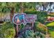 Lakeshore Village community sign surrounded by lush tropical foliage at 3880 Wilshire Cir # 28, Sarasota, FL 34238