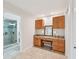 Dressing room features vanity with granite counters and private shower at 3880 Wilshire Cir # 28, Sarasota, FL 34238