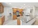 Well-lit kitchen featuring stainless steel appliances and a breakfast bar for casual dining at 3880 Wilshire Cir # 28, Sarasota, FL 34238