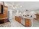 Kitchen and dining area with wood cabinets, stainless appliances, and lots of light at 3880 Wilshire Cir # 28, Sarasota, FL 34238