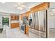 Well-equipped kitchen featuring stainless steel appliances and abundant wood cabinetry for storage at 3880 Wilshire Cir # 28, Sarasota, FL 34238