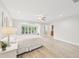 Spacious main bedroom with wood floors, sitting area and ensuite bath at 3880 Wilshire Cir # 28, Sarasota, FL 34238