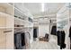 Huge walk-in closet with shelving and room for hanging clothes at 3880 Wilshire Cir # 28, Sarasota, FL 34238