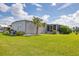 Charming single-story home with well-maintained lawn and mature palm tree at 4304 14Th E St, Ellenton, FL 34222