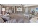 Inviting living room with comfortable seating, neutral tones, and seamless flow into the dining and kitchen areas at 4304 14Th E St, Ellenton, FL 34222