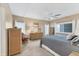 Comfortable bedroom with neutral tones, a ceiling fan, and natural light from the window at 4304 14Th E St, Ellenton, FL 34222