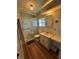 Bathroom with a glass door walk-in shower, vanity, and wood-look floor at 4527 13Th E St, Ellenton, FL 34222