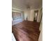 Bright bedroom with hardwood floors, closet, and ensuite bathroom at 4527 13Th E St, Ellenton, FL 34222