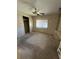 Bedroom with carpet, closet, and wood-paneled walls at 4527 13Th E St, Ellenton, FL 34222
