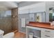 Bathroom featuring a tiled shower, vanity with storage, and a natural light window at 4532 La Jolla Dr, Bradenton, FL 34210