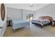 Spacious bedroom features neutral walls and an outdoor balcony at 4532 La Jolla Dr, Bradenton, FL 34210