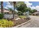Community entrance and landscaping featuring mature trees, shrubs and flowers at 4532 La Jolla Dr, Bradenton, FL 34210