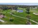 Beautiful aerial view of the golf course featuring a water hazard and sand traps at 4532 La Jolla Dr, Bradenton, FL 34210