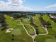 Scenic golf course view with lush green fairways and water hazards under a partly cloudy sky at 4532 La Jolla Dr, Bradenton, FL 34210
